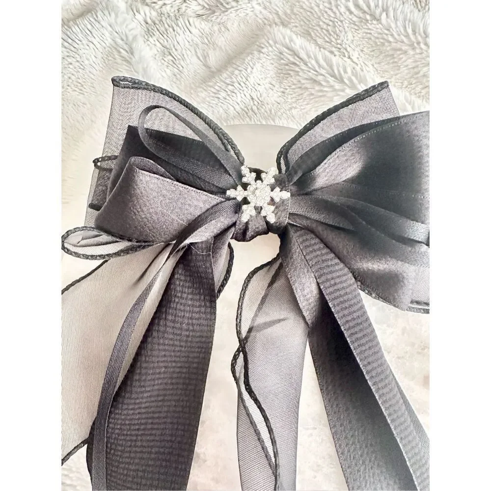 Black ribbon hair bow with snowflake charm￼